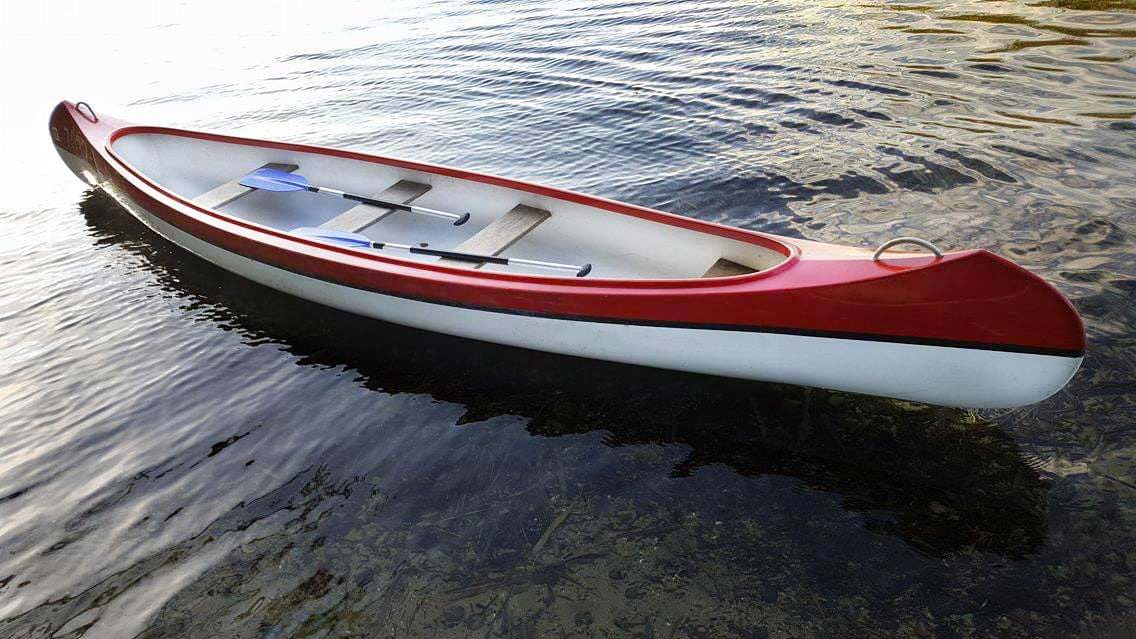 Fiberglass Canoe in the lake - rent